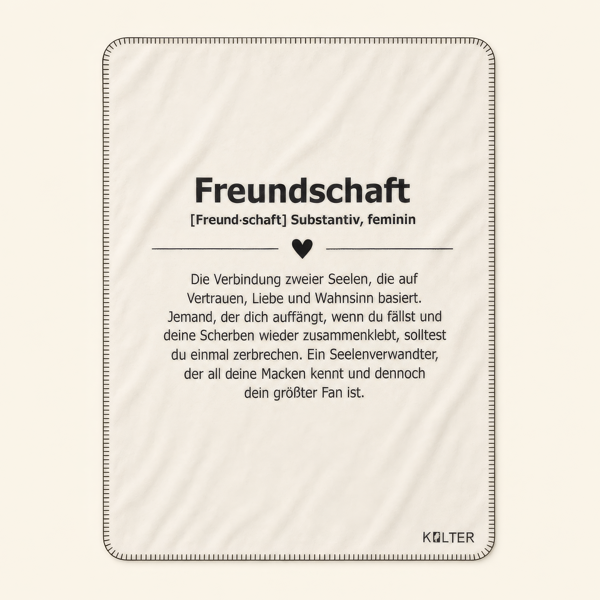 Kolter Decke mit Text über Freundschaft und Herzsymbol.