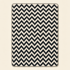 Kolter Decke mit Zickzack-Muster in Schwarz-Weiß.