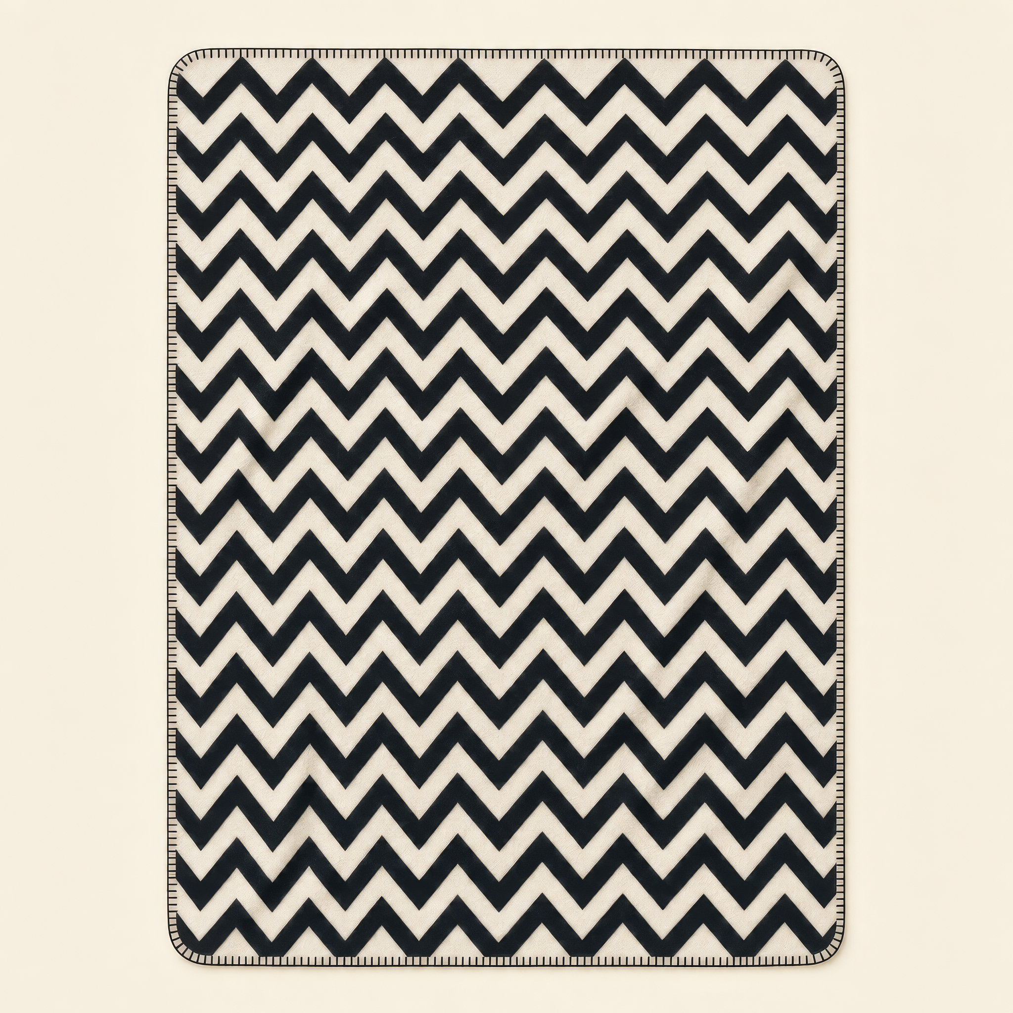 Kolter Decke mit Zickzack-Muster in Schwarz-Weiß.